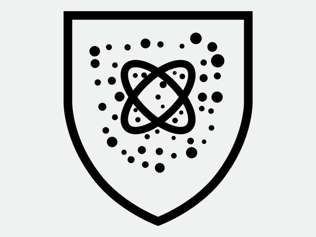Atome entouré de particules (symbole, en forme de panneau)